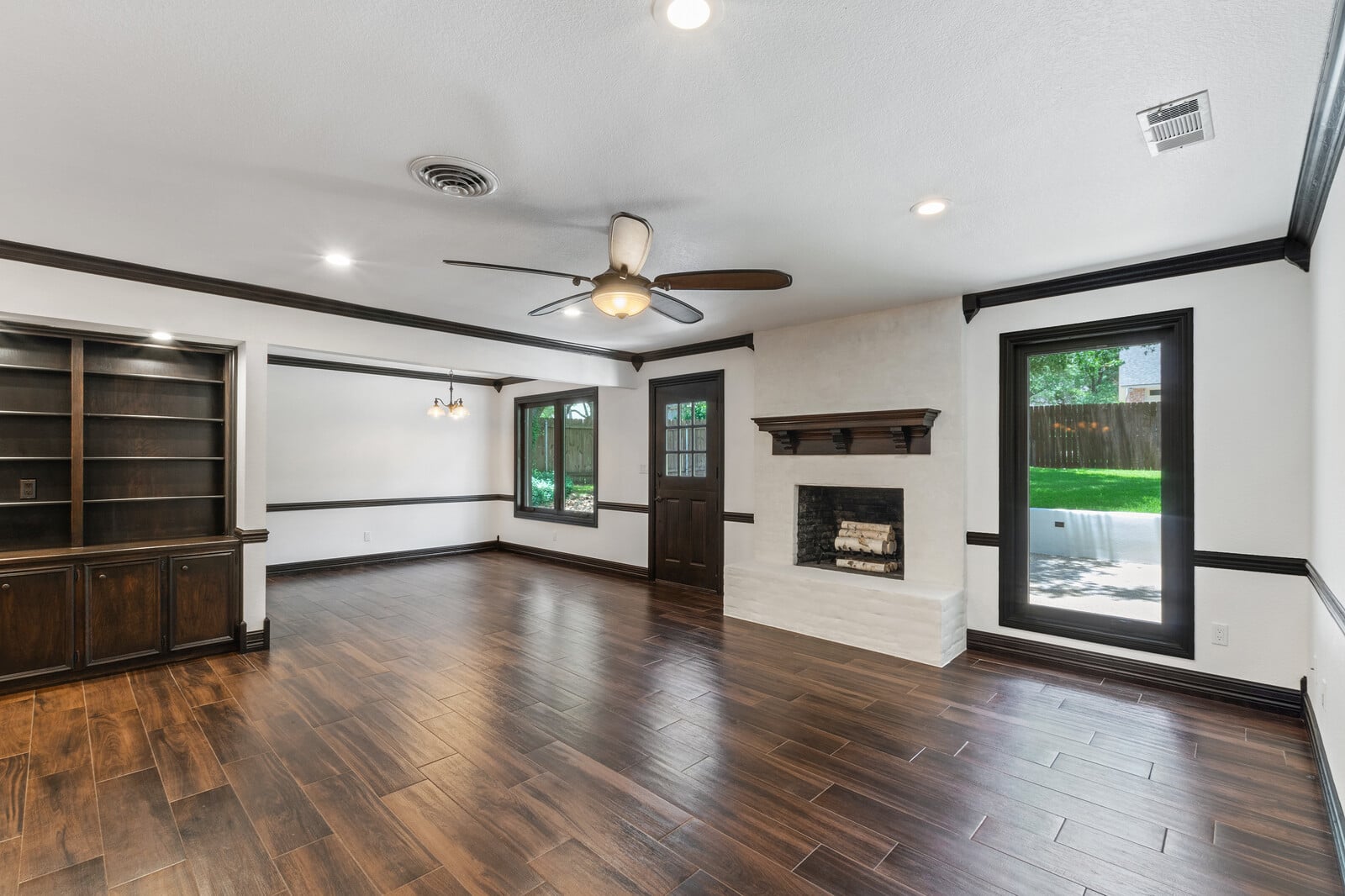 An image of an unfurnished living room, pre staging